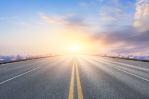 road leading into sun