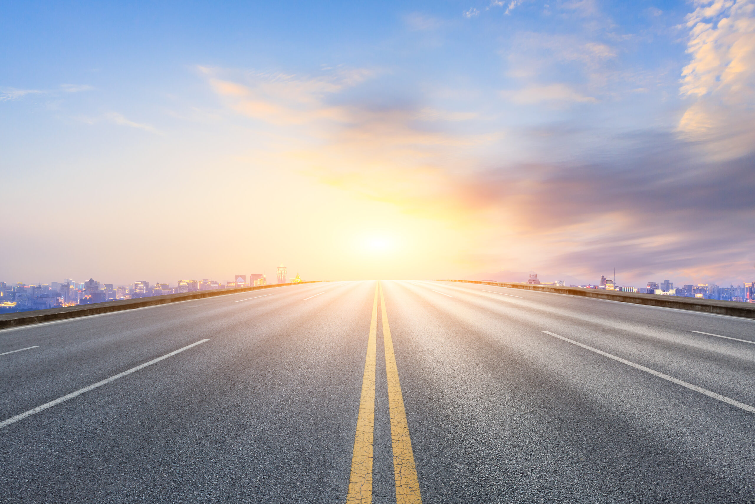 road leading into sun